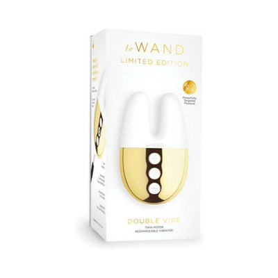 Le Wand Double Vibe limited edition twin motor rechargeable vibrator in white and gold packaging.