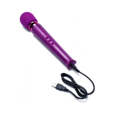 Purple rechargeable wand massager with USB charging cable on white background.