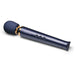 Sleek navy blue Le Wand Petite rechargeable massager with gold accents and control buttons on the handle.