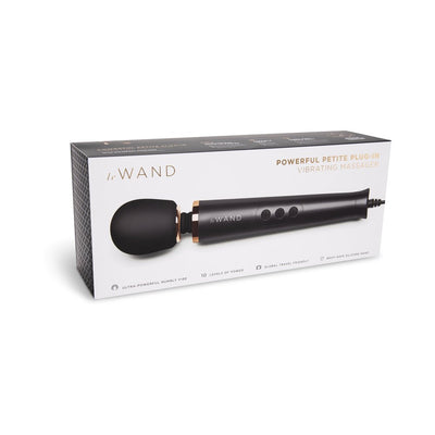 Le Wand Powerful Petite Plug-In Vibrating Massager in black with silicone head shown in retail packaging.
