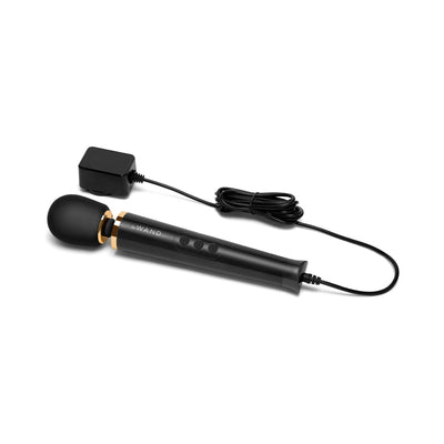 Le Wand Powerful Petite Plug-in massager in black with flexible silicone head and long cord charger on white background.