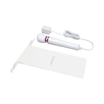 Le Wand Powerful Petite Plug-in massager in white with flexible head, attached power cord, and branded storage pouch.