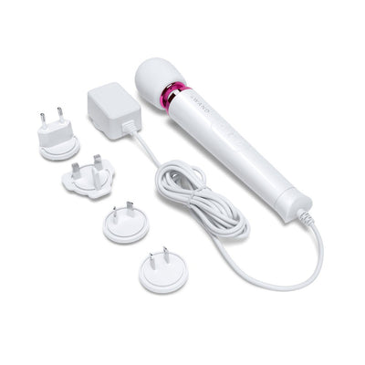 Le Wand Powerful Petite Plug-in massager with white body, pink accent, 8-foot cord, and multiple international plug adapters.