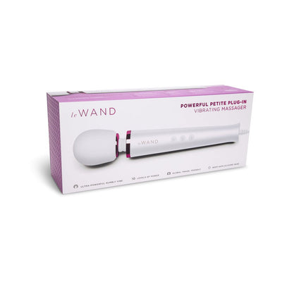 Le Wand Powerful Petite Plug-In Vibrating Massager in white with pink accents shown on packaging box.