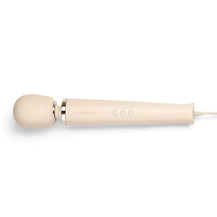 Le Wand Powerful Plug-in Vibrating Massager in beige with silicone head and three-button control on handle.