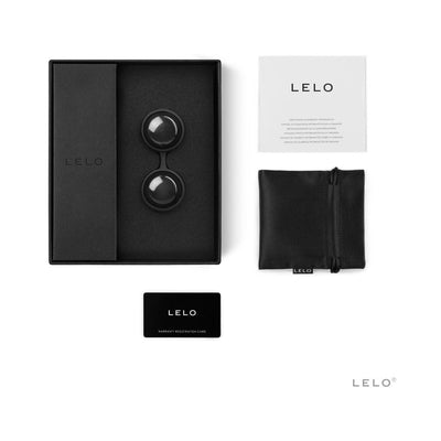 LELO Beads Noir set with two black beads in silicone harness, black storage pouch, user manual, and warranty card on white background.