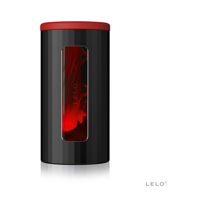 Lelo F1s V2 Masturbator in black and red with a sleek cylindrical design and a transparent window showing the inner sleeve.