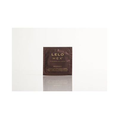 Single LELO HEX Respect XL condom in dark brown packaging with gold lettering on a white reflective surface.