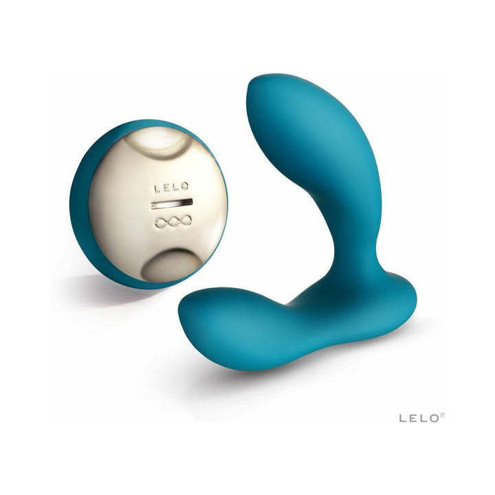 Teal rechargeable prostate massager with curved design and matching wireless remote control with metallic finish.