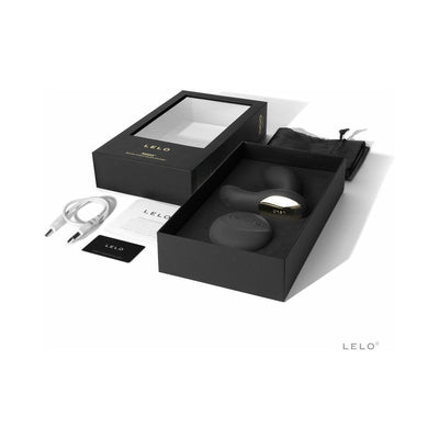Lelo Hugo prostate massager with remote, USB charging cable, storage pouch, and packaging box on white background.