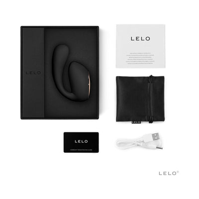 Lelo Ida Wave dual stimulator in black with packaging, USB charging cable, satin pouch, user manual, and warranty card.