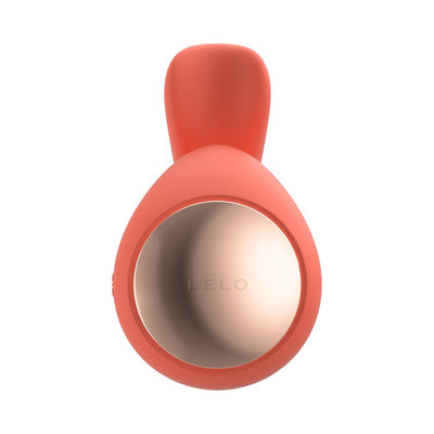 Top view of coral-colored Lelo Ida Wave dual stimulator with smooth silicone and metallic accent ring.