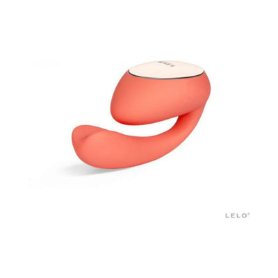 Coral-colored Lelo Ida Wave dual stimulator with curved design and white control panel on top, displayed on white background.