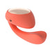 Coral-colored Lelo Ida Wave dual stimulator with smooth silicone finish and gold-toned top detail.