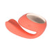 Coral-colored Lelo Ida Wave dual stimulator with smooth silicone body and rose gold accent top, designed for G-spot and clitoral stimulation.
