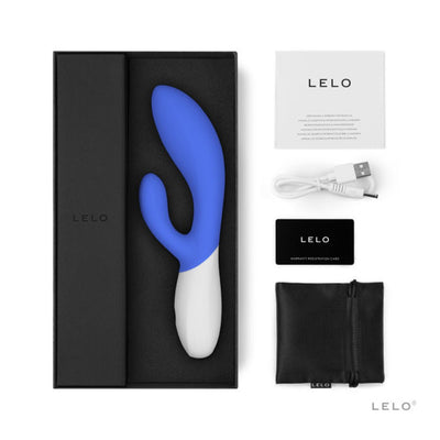 Lelo Ina Wave 2 dual stimulator in blue and white with USB charging cable, storage pouch, warranty card, and instruction manual in black box.