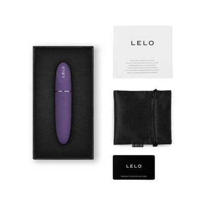 Purple Lelo Mia 3 personal vibrator in black box with user manual, black storage pouch, and warranty card on white background.