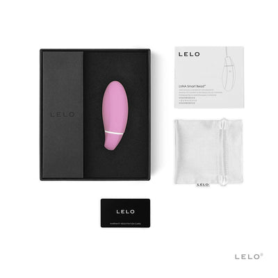 LELO Smart Bead in pink with black storage box, user manual, satin pouch, and warranty card displayed on white background.