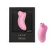 Pink Lelo Sona Cruise clitoral stimulator with ergonomic design shown inside black packaging and standing beside it.