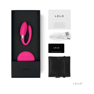 Lelo Tiani 2 couples massager in pink with wireless remote, USB charging cable, storage pouch, and user manuals in black box packaging.