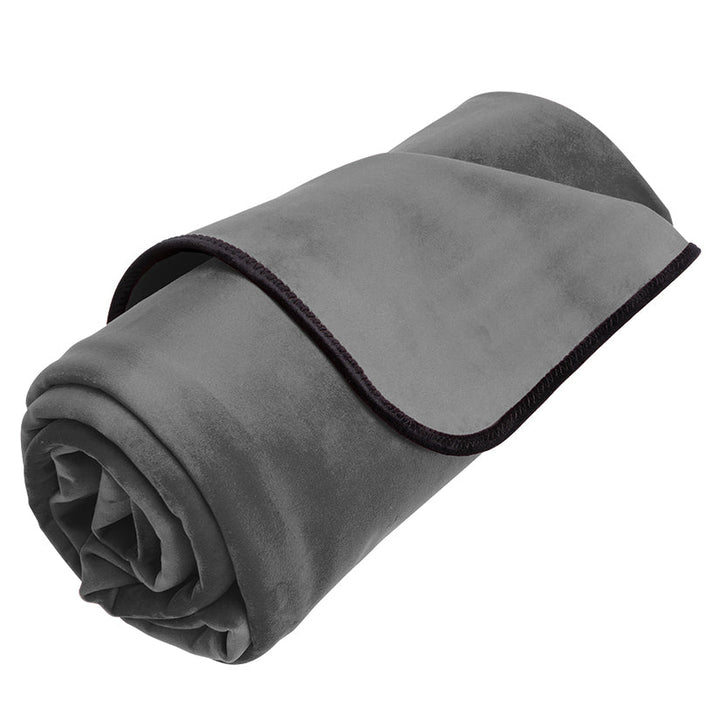 Rolled gray plush waterproof throw blanket with black trim, designed for easy cleanup and moisture protection.