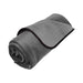 Rolled plush gray waterproof Liberator Fascinator Throw with black trim for travel and easy cleanup.