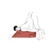 Illustration of two figures using a red Liberator Wedge/Ramp Combo cushion for support in an intimate position.