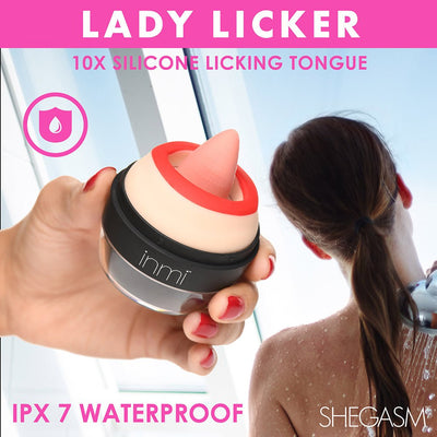 Hand holding a red and pink silicone clitoral stimulator with textured tongue, woman showering in background, waterproof design.