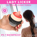 Hand holding a red and pink silicone clitoral stimulator with textured tongue, woman showering in background, waterproof design.