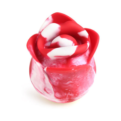 Red and white silicone rose-shaped clitoral stimulator with smooth, curved petals on a white background.