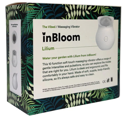 In Bloom Lilium massaging vibrator packaging with tropical leaf design and product description on box.