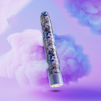 Slimline 7-inch rechargeable vibrator with floral pattern on a soft purple and pink smoky background.