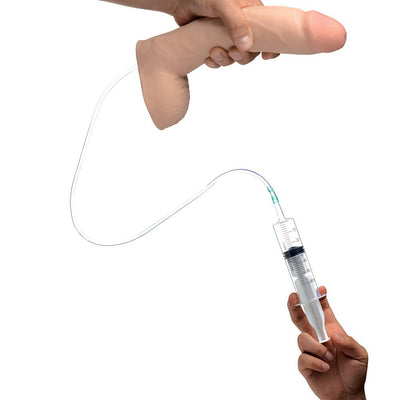 Hand holding a realistic dual-density 10-inch dildo connected to a syringe with tubing for fluid release.