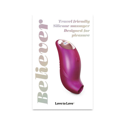 Compact iridescent purple silicone massager with ergonomic design, travel-friendly and designed for pleasure.
