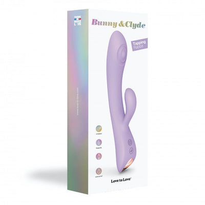 Packaging box of Bunny & Clyde dual stimulator in lavender with ergonomic design and control buttons shown on front.