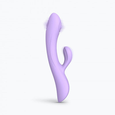 Lavender dual stimulator with curved design and separate clitoral arm, made of smooth silicone.