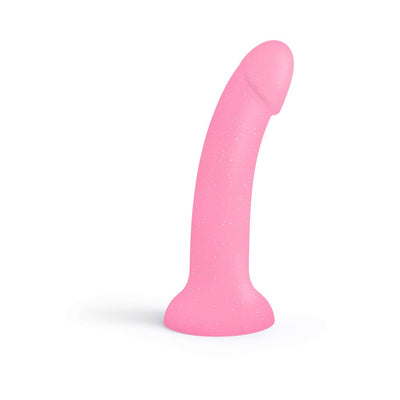 Pink curved silicone dildo with glitter and suction cup base, standing upright on white background.