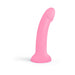 Pink curved silicone dildo with glitter and suction cup base, standing upright on white background.