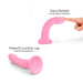 Pink flexible silicone dildo with suction cup base, shown bent and pressed for comfortable insertion.