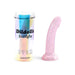 Pink translucent curved silicone toy with star-shaped glitter and suction base next to iridescent cylindrical packaging.