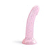 Curved pastel pink silicone toy with multicolored star glitter and suction base for hands-free use.
