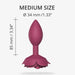 Medium-sized plum-colored anal plug with rose petal base, 85mm length and 34mm diameter, ergonomic design.