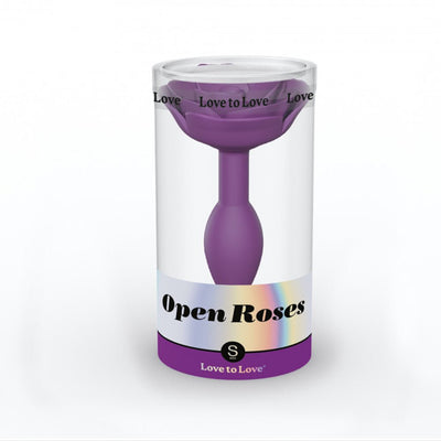 Small purple silicone anal plug shaped like a rose, packaged in a clear cylindrical container with Open Roses branding.