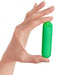 Hand holding a compact green silicone bullet vibrator against a white background.