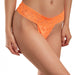 Close-up of a woman wearing bright orange lace G-string panties with floral patterns and scalloped edges.