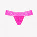 Bright pink lace G-string panty with floral pattern and scalloped edges, designed for discreet wearable pleasure.