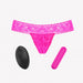 Pink lace G-string panty with a compact pink bullet vibrator and black wireless remote control.