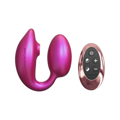 Pink Love To Love Wonderlover dual stimulator with flexible design and matching rose gold remote control on white background.