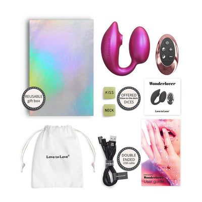 Love To Love Wonderlover remote-controlled pink clitoral and G-spot stimulator with reusable gift box, glow-in-the-dark dice, USB cable, pouch, and user guide.