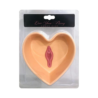 Heart-shaped candy dish in peach with a pink vulva design at the center, packaged for adult-themed celebrations.